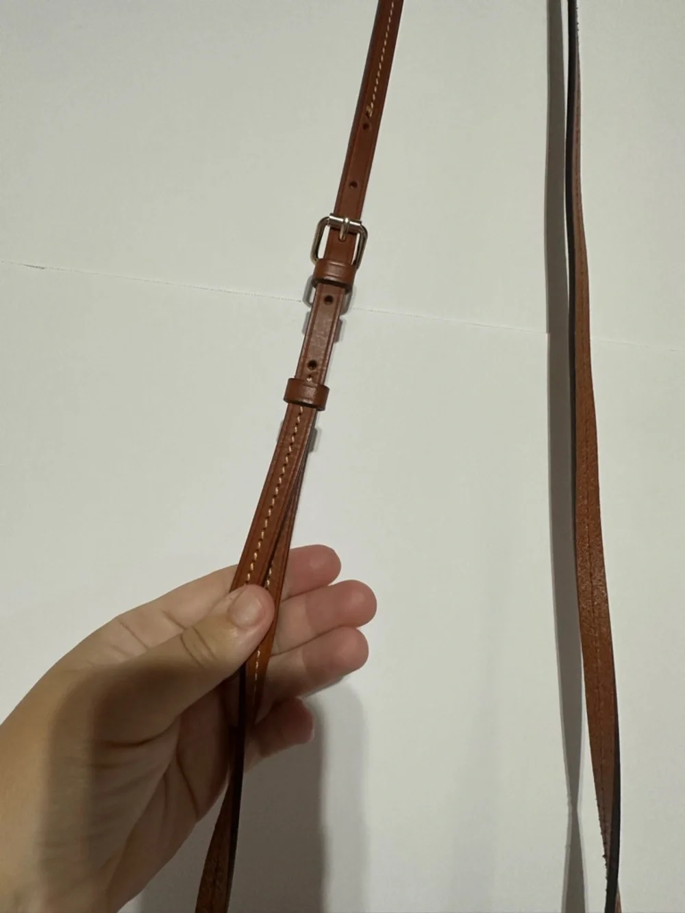 Dooney & Bourke North South Triple Zip Black Crossbody with Brown Leather Strap